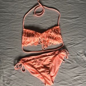 A Peach/salmon bathing suit set.